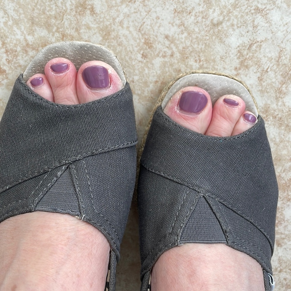 Toms wedges/espadrilles in size 9.5 wide. Dark grey color, woven heel.